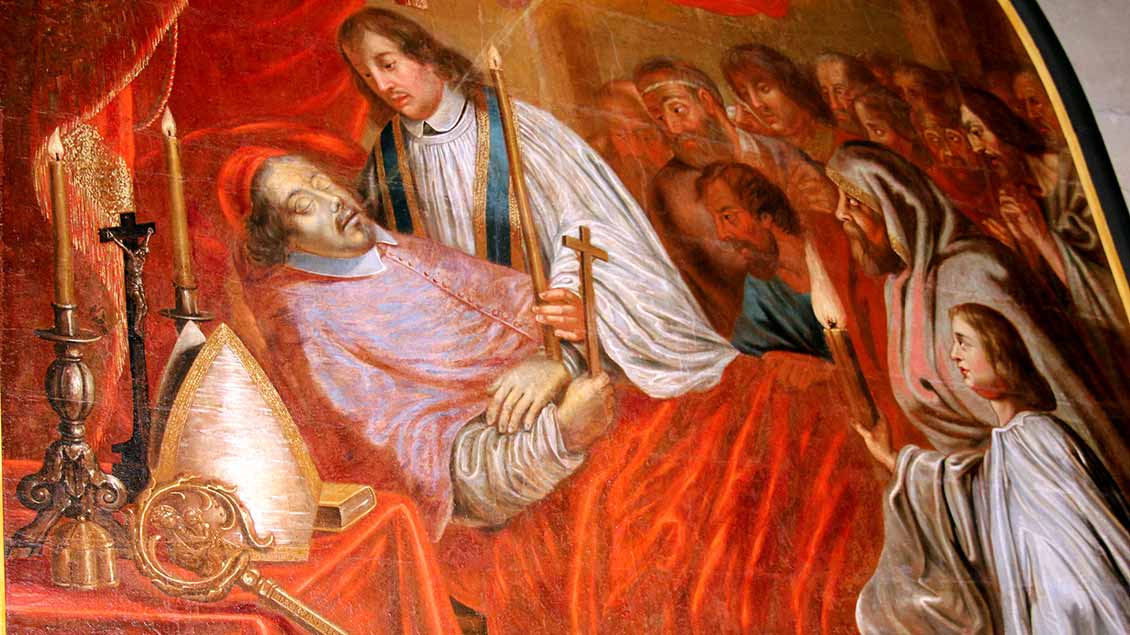 Die in einem Gemälde im Billerbecker Dom dargestellte Sterbeszene zeigt den heiligen Ludgerus in seinem Bett mit einem roten Samtüberwurf umringt von einem Priester und seinen Anhängern. 
