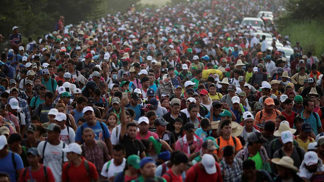Menschen auf der Flucht. Foto: Ueslei Marcelino (Reuters)
