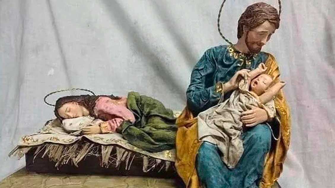 Brasilianische Krippe: Josef wiegt das Jesuskind, Maria schläft.