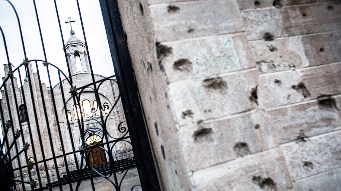 Einschusslöcher an der Außenmauer von St. Georg. | Foto: Missio